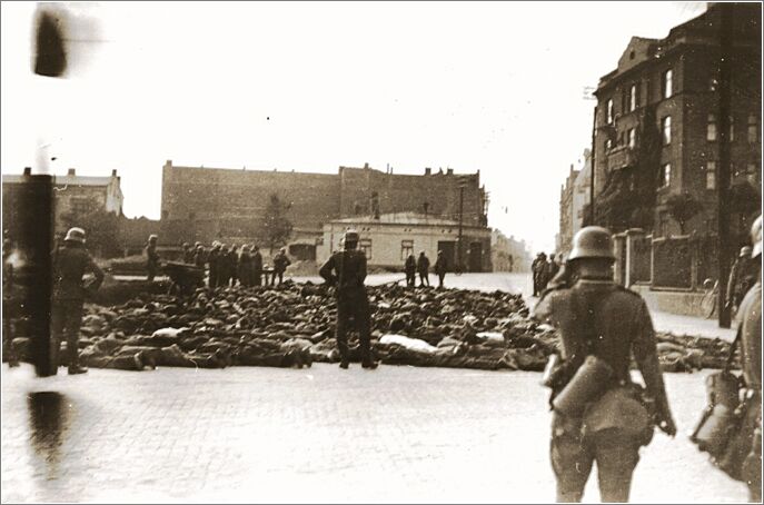German soldiers patrol a public square in Czestochowa, where the bodies of those they shot have been collected